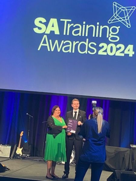 Tracey receiving her certificate